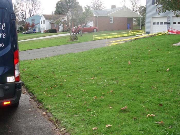 A police van is parked in front of a house