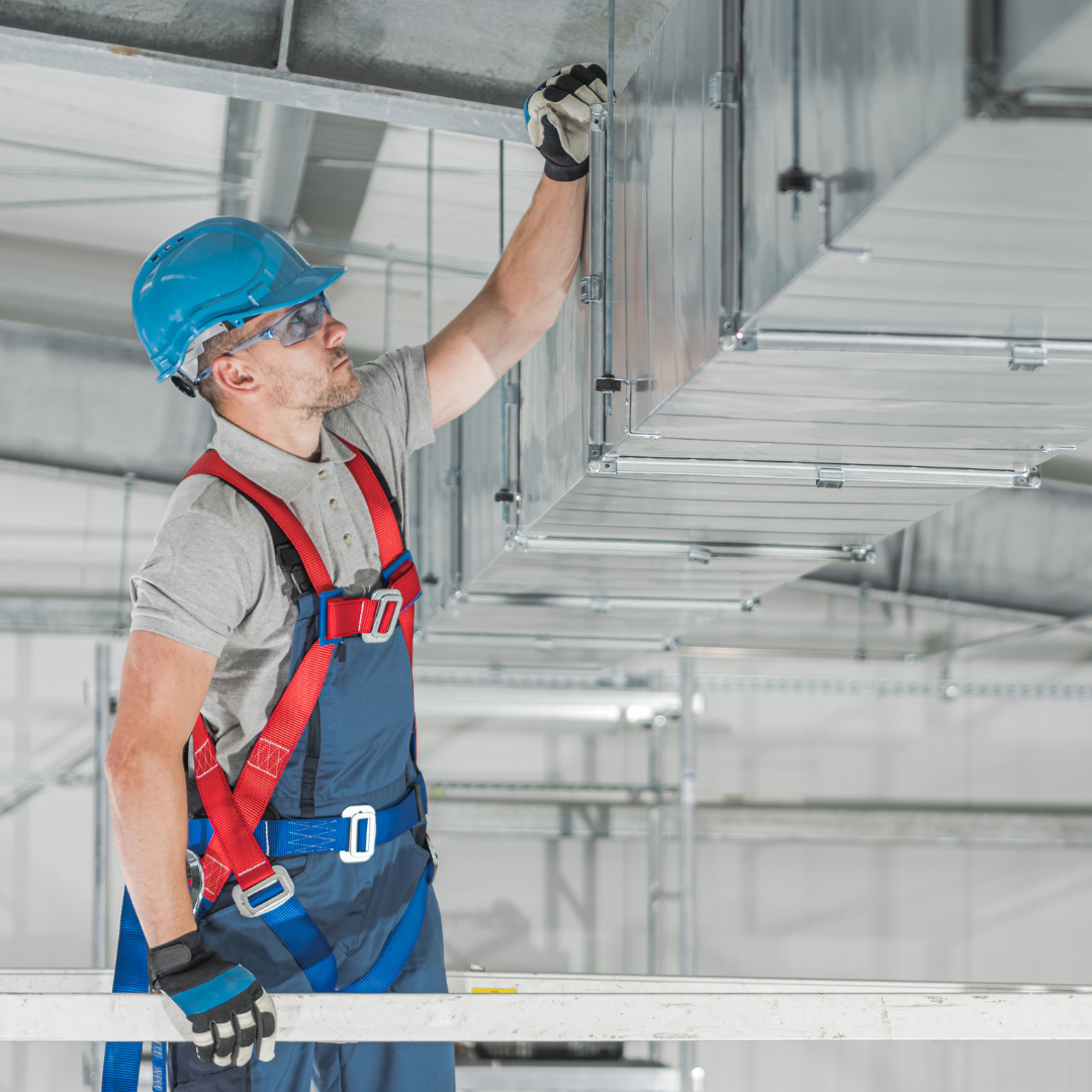 HVAC Tech investigating industrial HVAC system