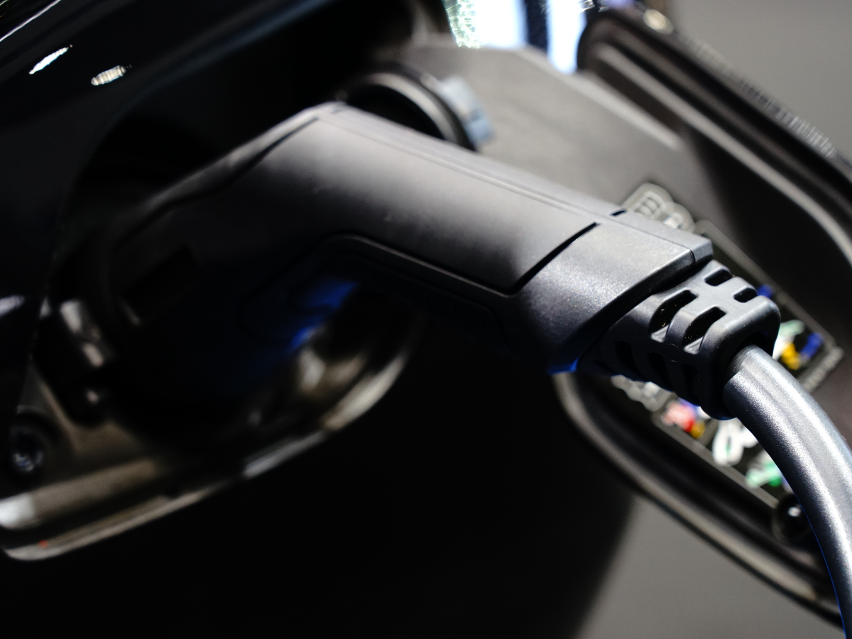 A car is being charged with a WS Mechanical EV charger on it