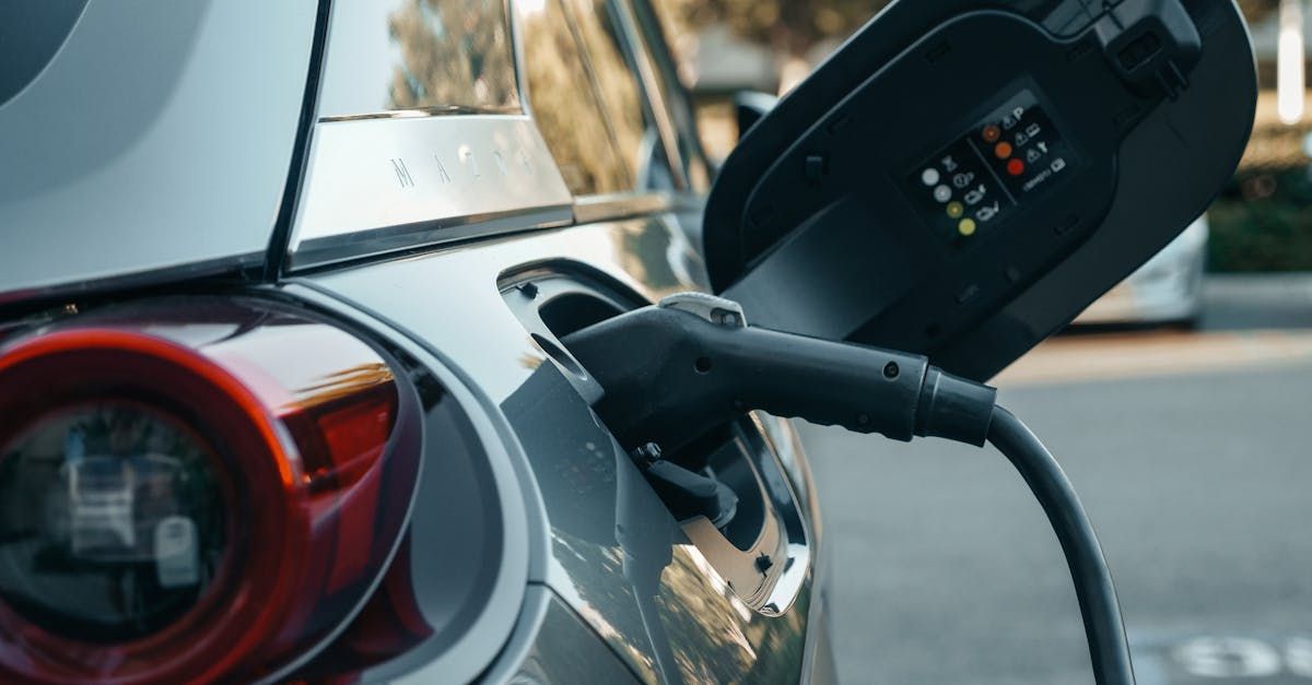 An electric car is being charged at a charging station.