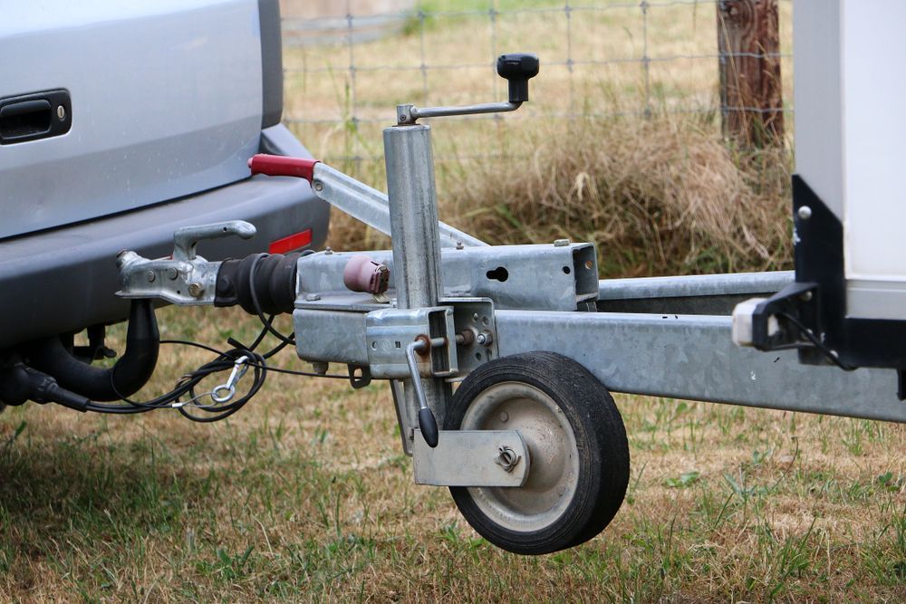 Man Checking The Electric Outlet In The Caravan — Mobile Auto Electrician In Tweed Heads, QLD