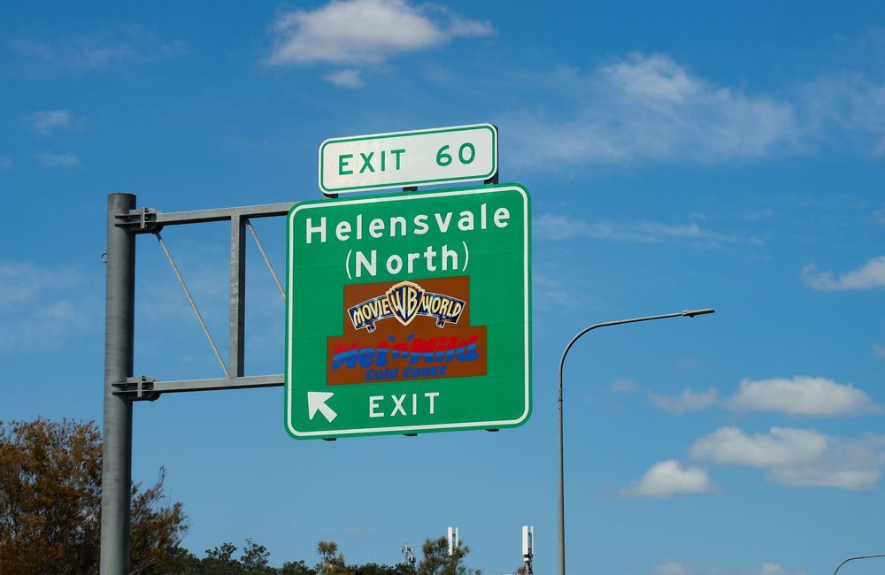 Green highway sign for Helensvale — Glenn Rowe Auto Electrics In Helensvale, QLD