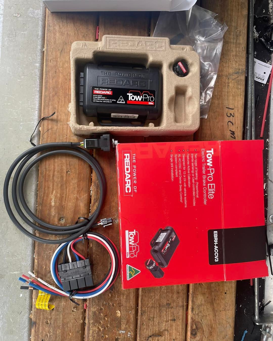 Tow-pro Elite Brake Controller Kit on a Wooden Surface — Glenn Rowe Auto Electrics In Coolangatta, NSW