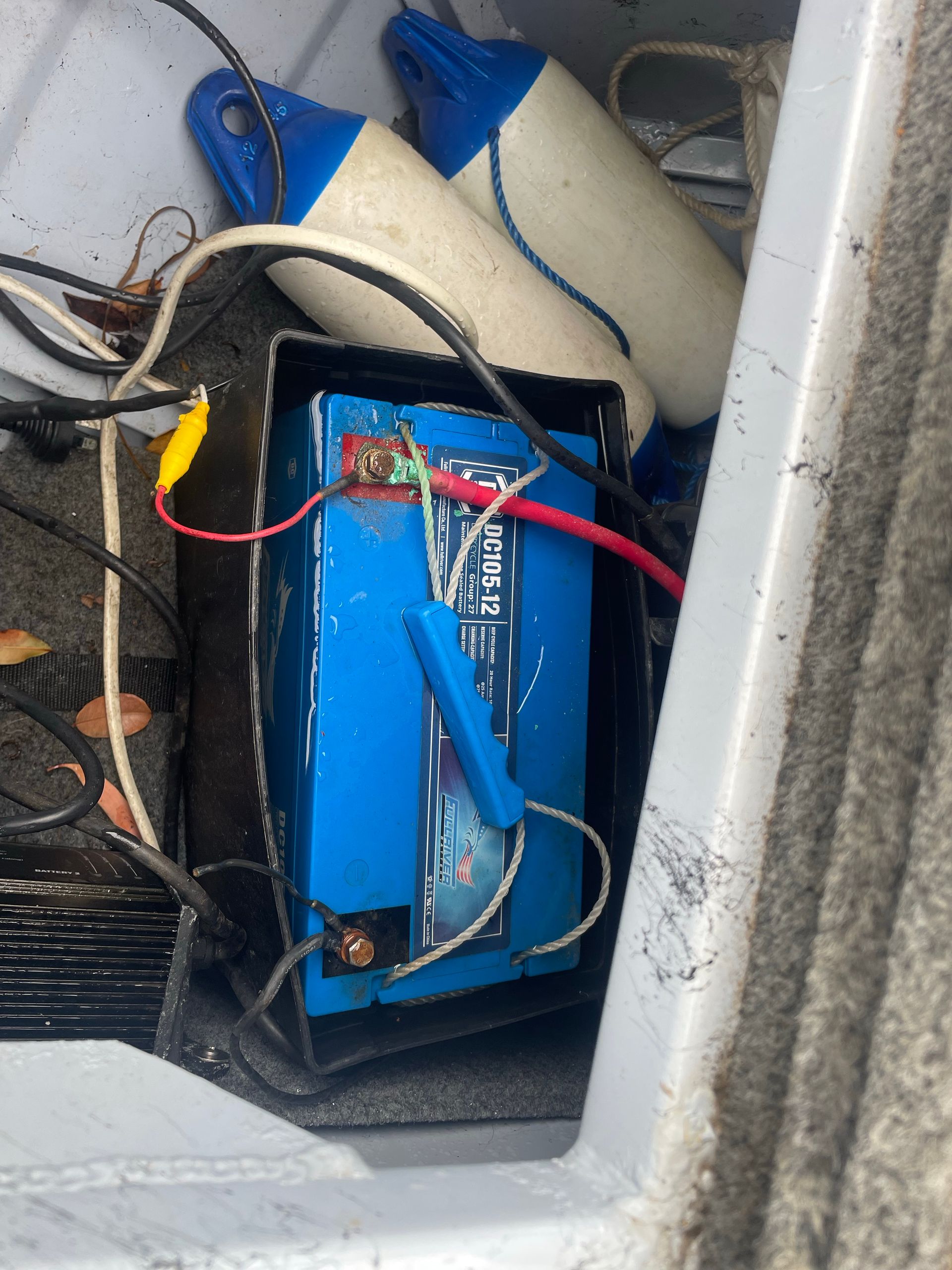 Blue Boat Battery With Connected Wires Inside a Compartment — Glenn Rowe Auto Electrics In Helensvale, QLD