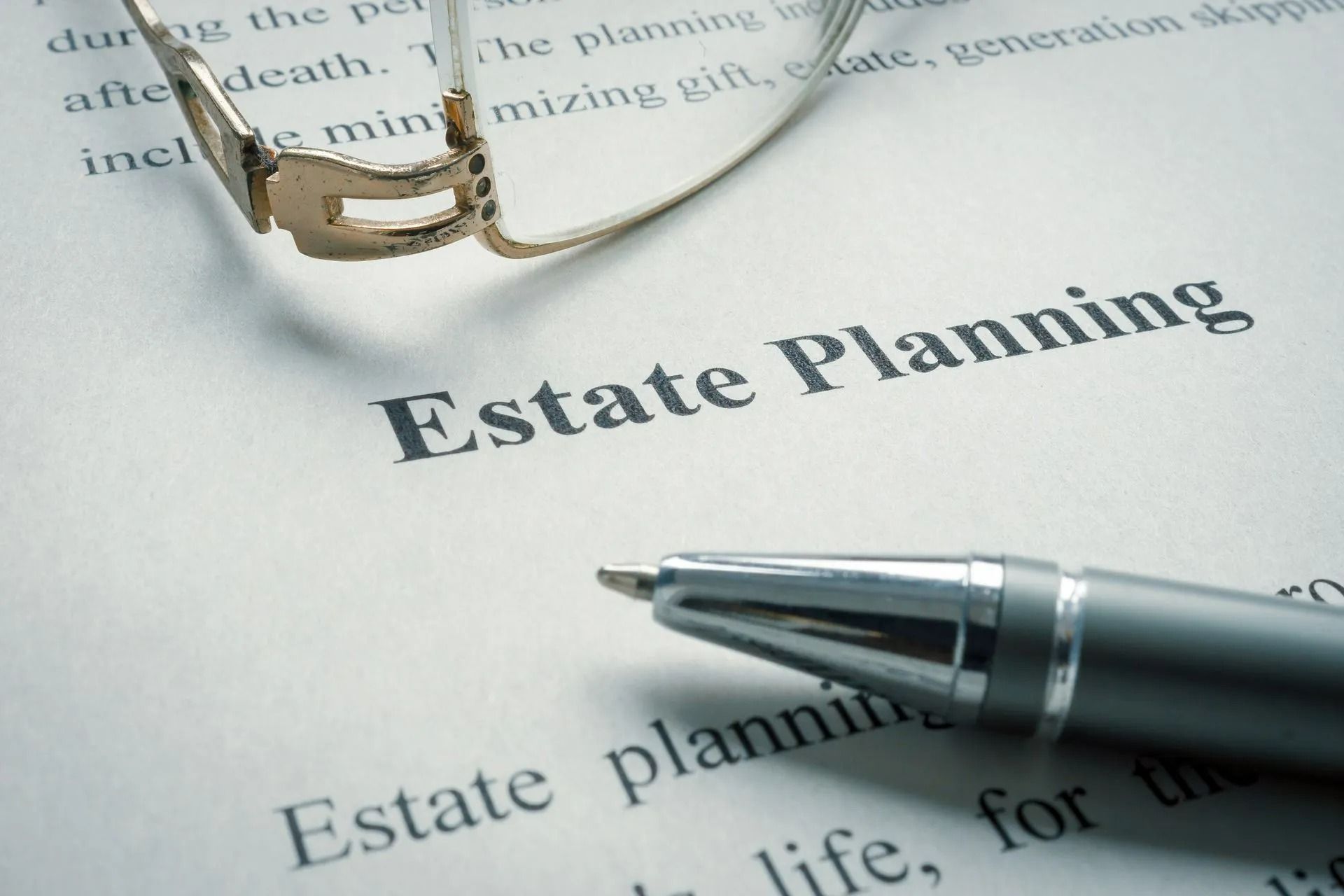 Estate planning document with pen and eyeglasses on a desk
