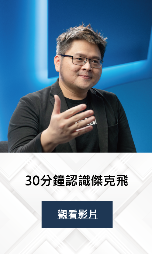 A man wearing glasses and a suit is giving a speech.