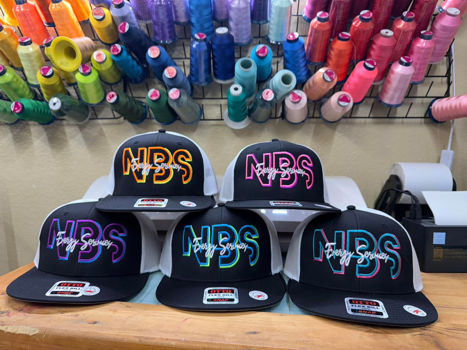 A bunch of hats with the word nbs on them