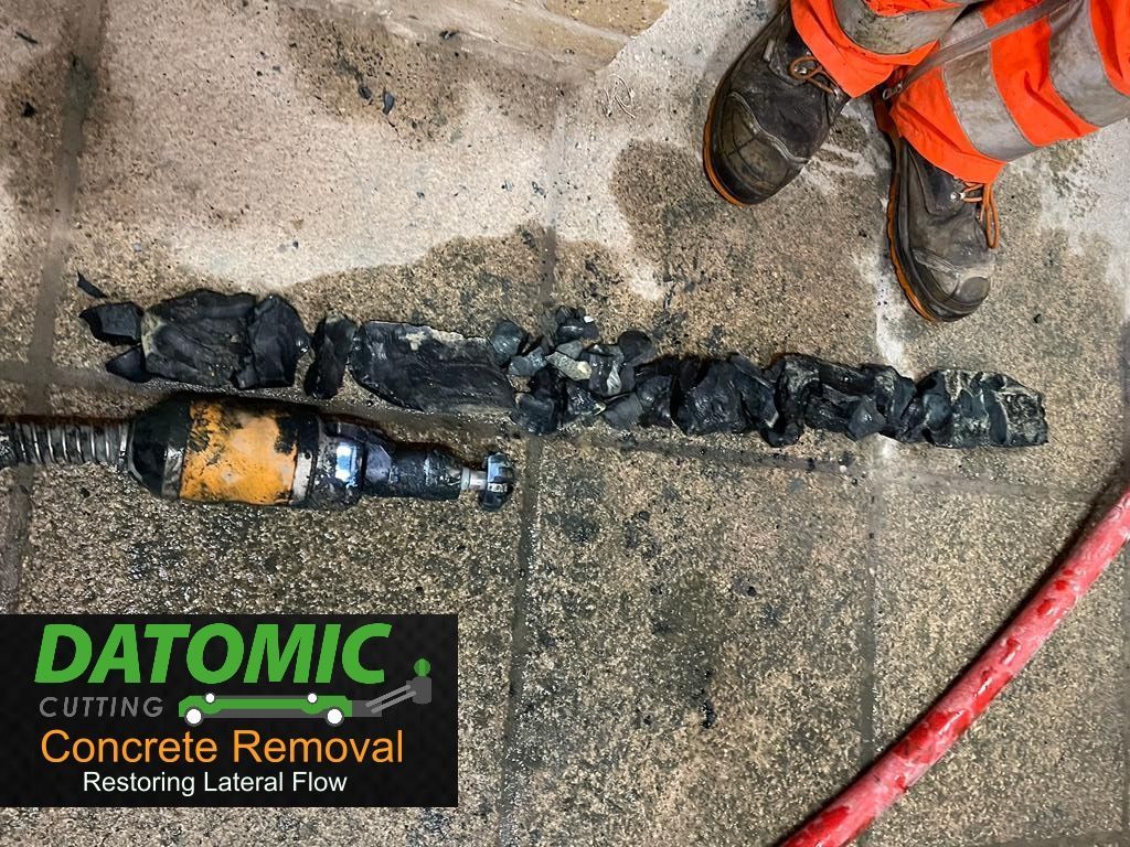 removing concrete from blocked drains