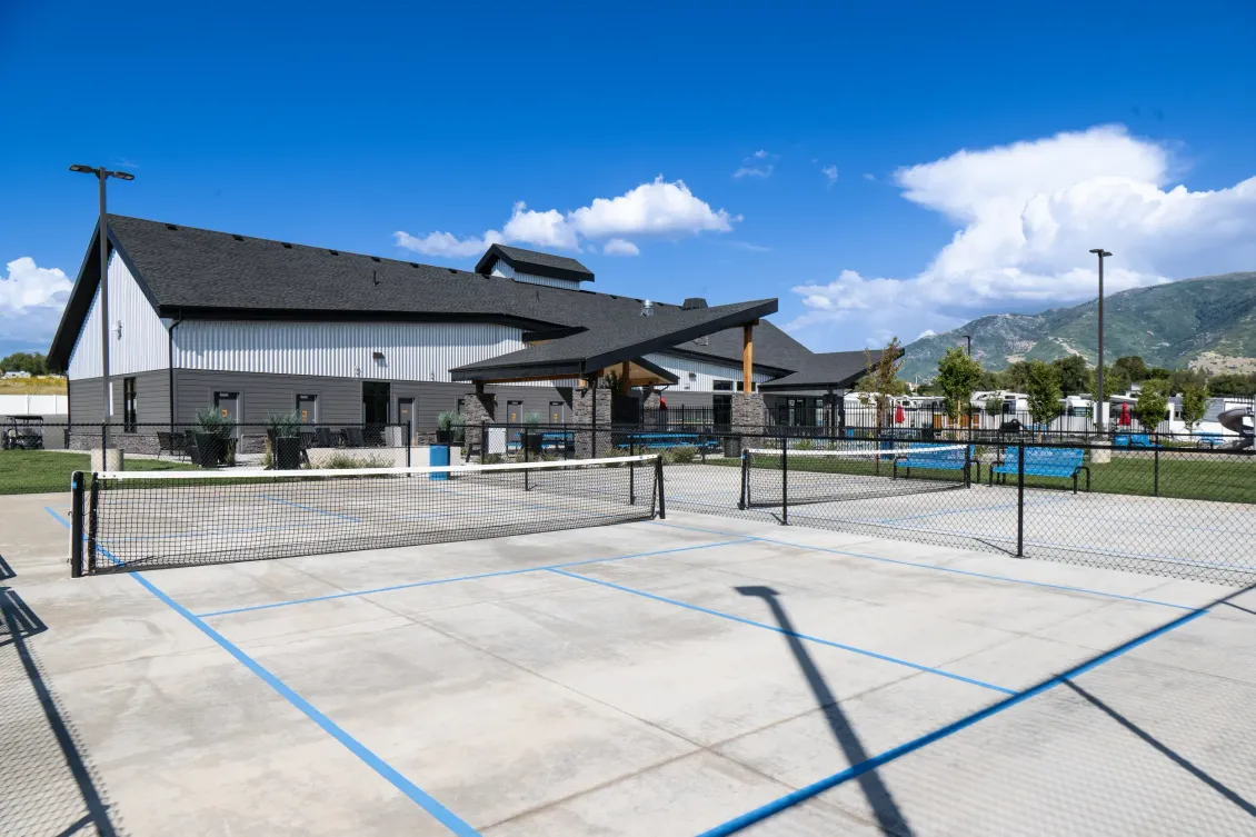 There is a volleyball court in front of a house.