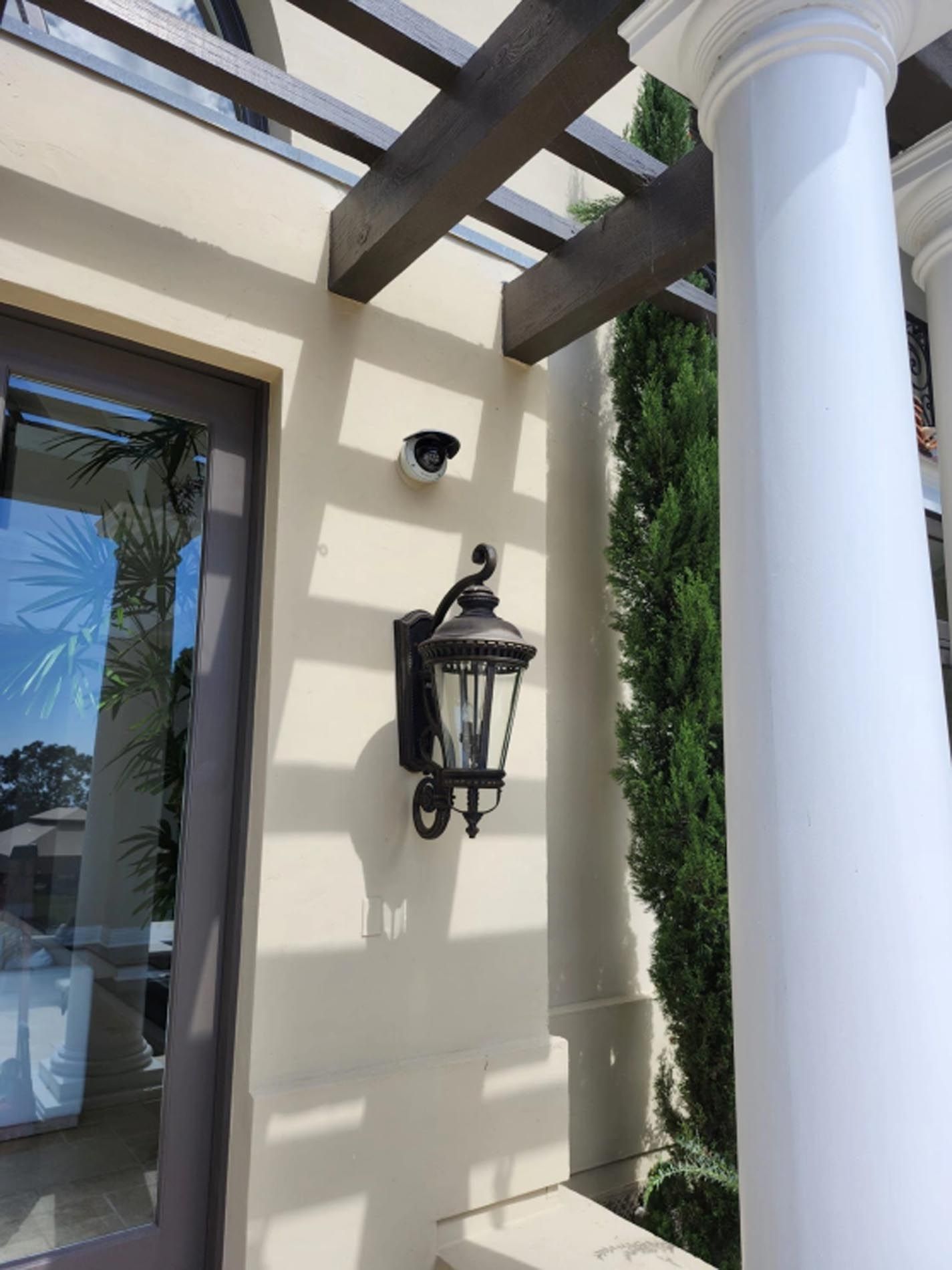 A lantern is hanging on the side of a building