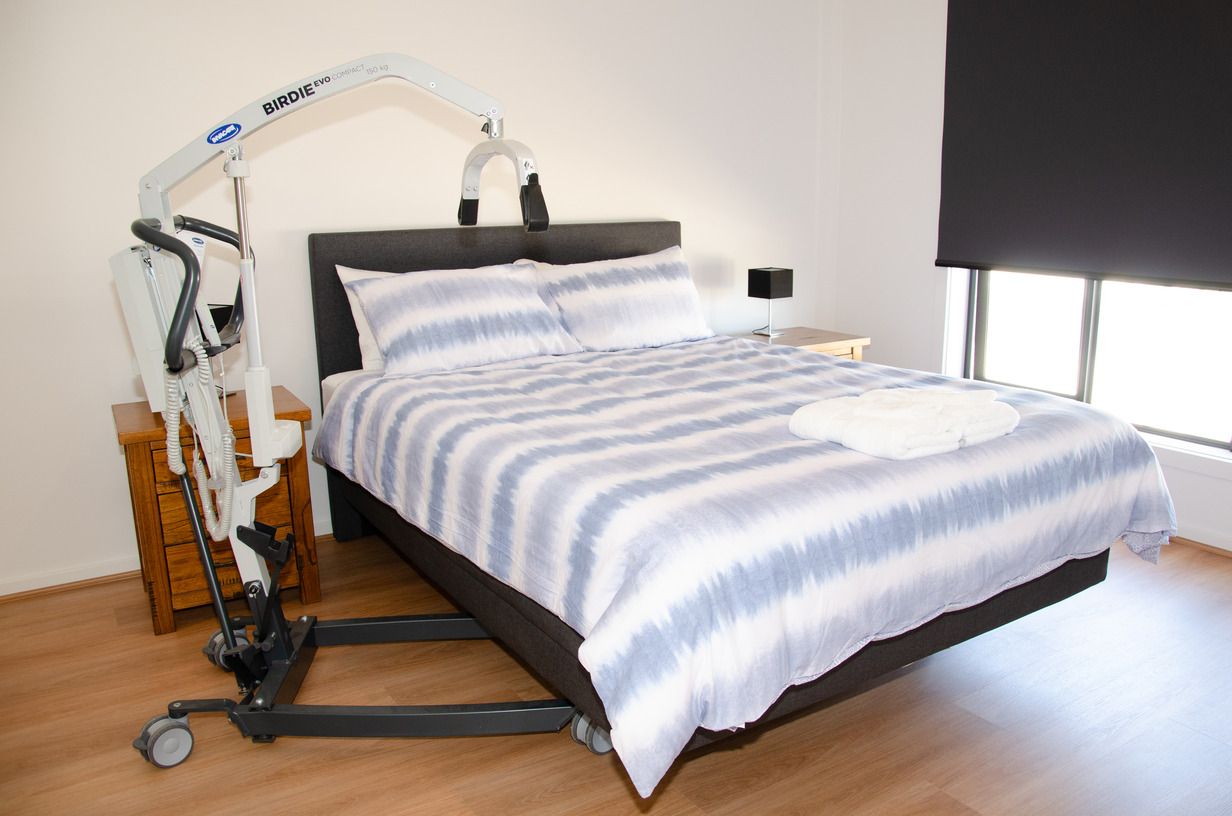 A bed with a lift attached to it in a bedroom.
