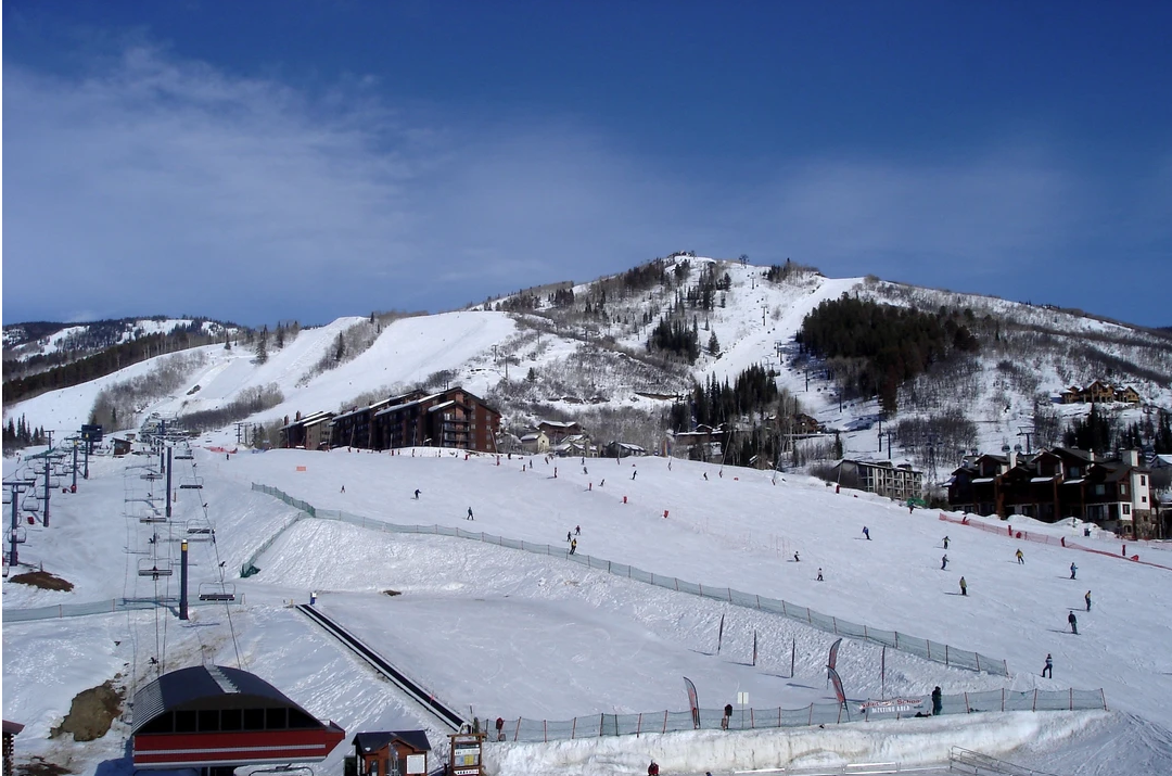 A ski resort with a lot of snow on the slopes