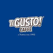 il logo del caffè tigusto è su sfondo blu .