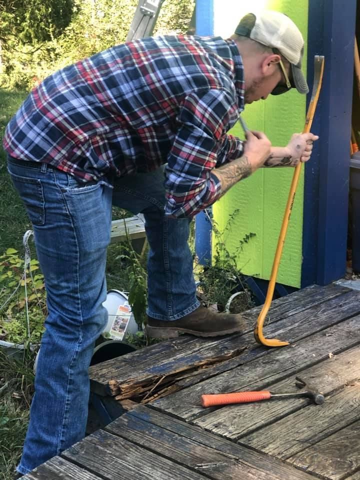 Man Removing Old Planks – Morgantown, WV – O'connor Contracting