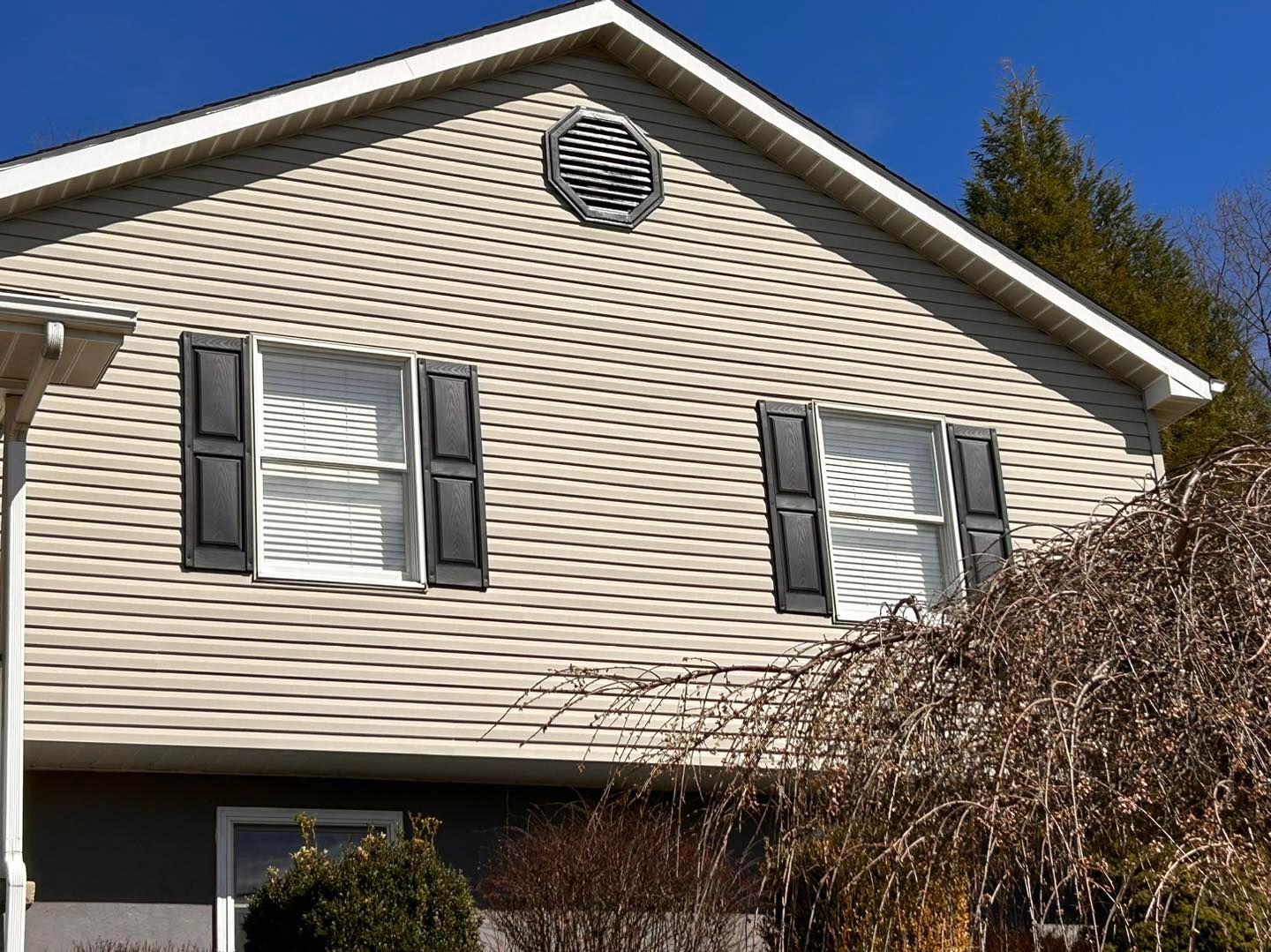 Outdoor Daylight View Of A Wall With Two Windows – Morgantown, WV – O'connor Contracting