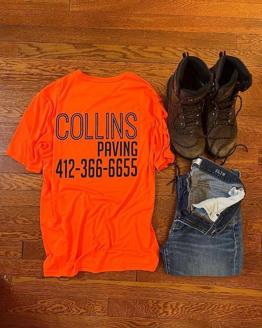 an orange shirt with collins paving on it
