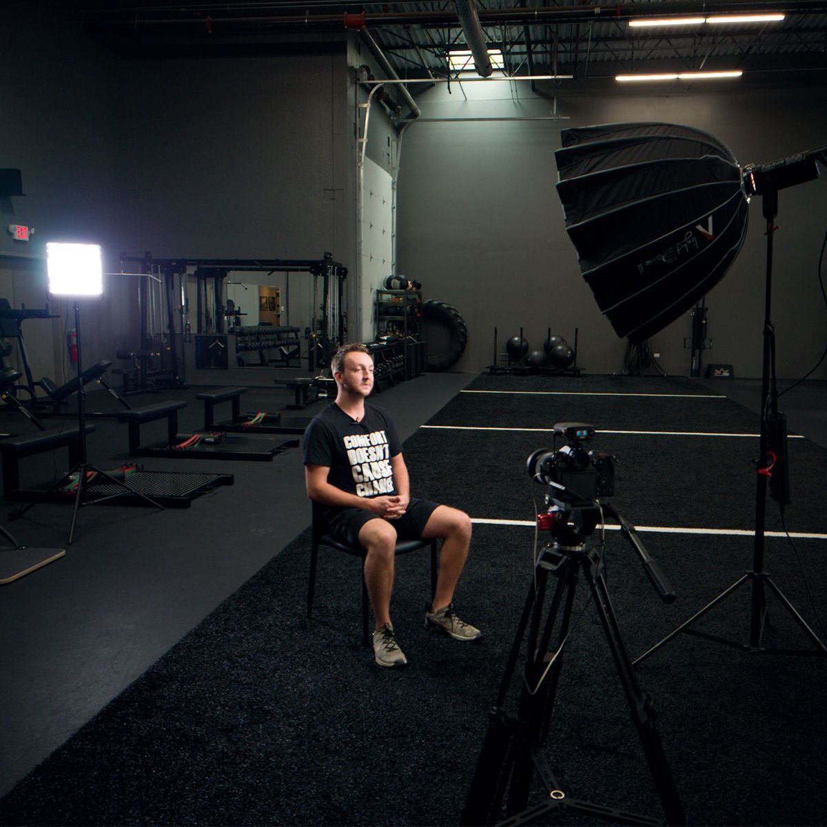 Behind-the-scenes photo of Calvisions filming a profile video at Prototype Fitness, with camera crew, lighting equipment, and on-location setup.