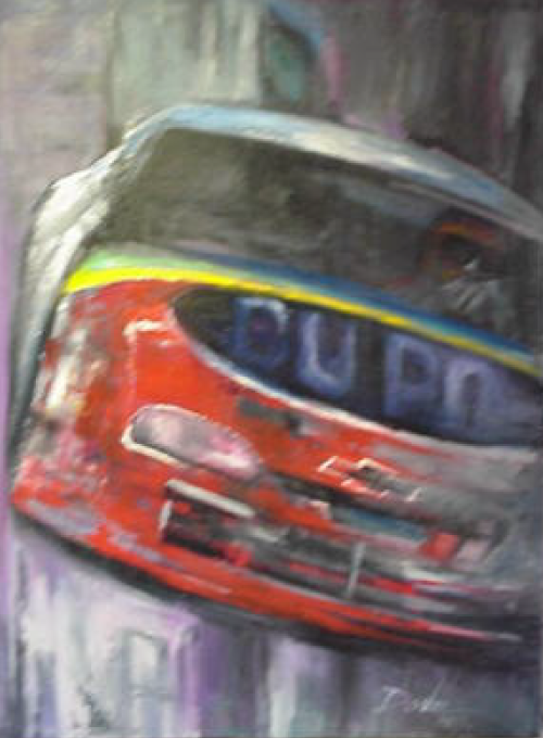 Red race car speeding down a track, with blurred background. "DU PONT" visible on the car.