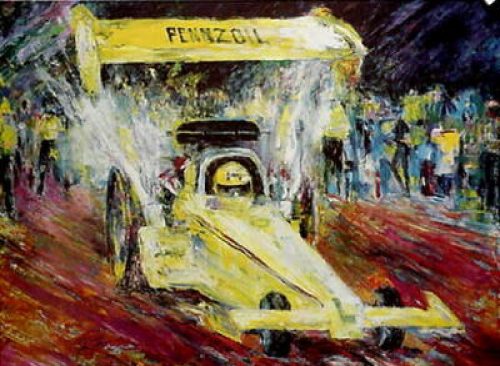 Yellow Pennzoil race car with a large spoiler, spraying water, racing; spectators in the background.