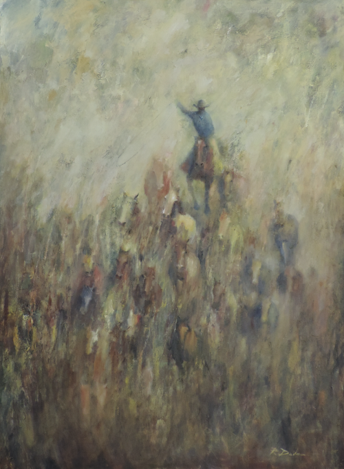 Cowboy on horseback raises arm, leading a herd of horses across a misty field.