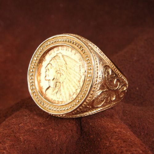 Gold ring featuring an Indian Head gold coin, set in a decorative setting.