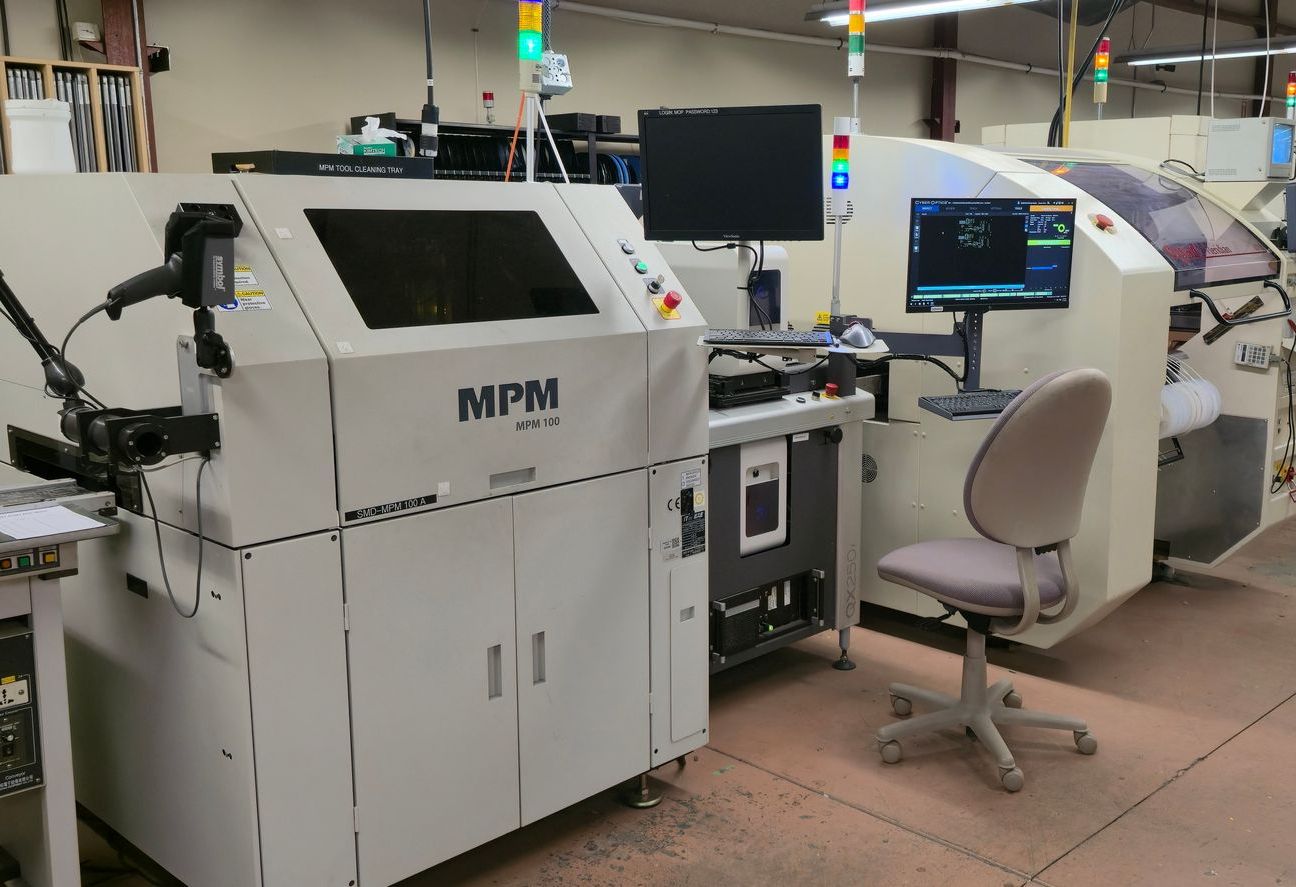 A machine is sitting in a room next to a chair.