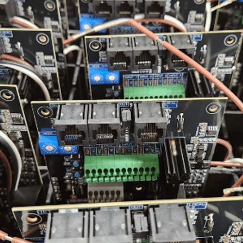 A close up of a bunch of electronic components with the word t on one of them