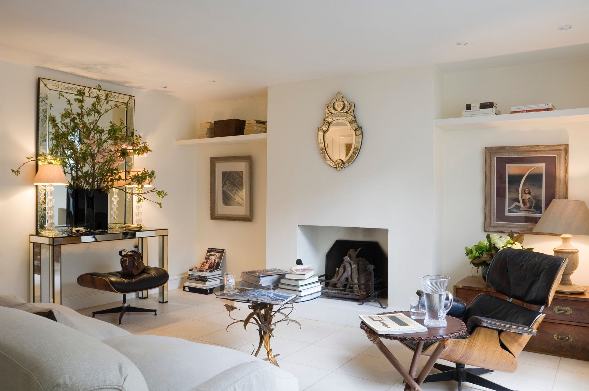 Patio with stone paving, outdoor furniture, and a house with green siding. Sunny day. Patio with stone paving, outdoor furniture, and a house with green siding. Sunny day.