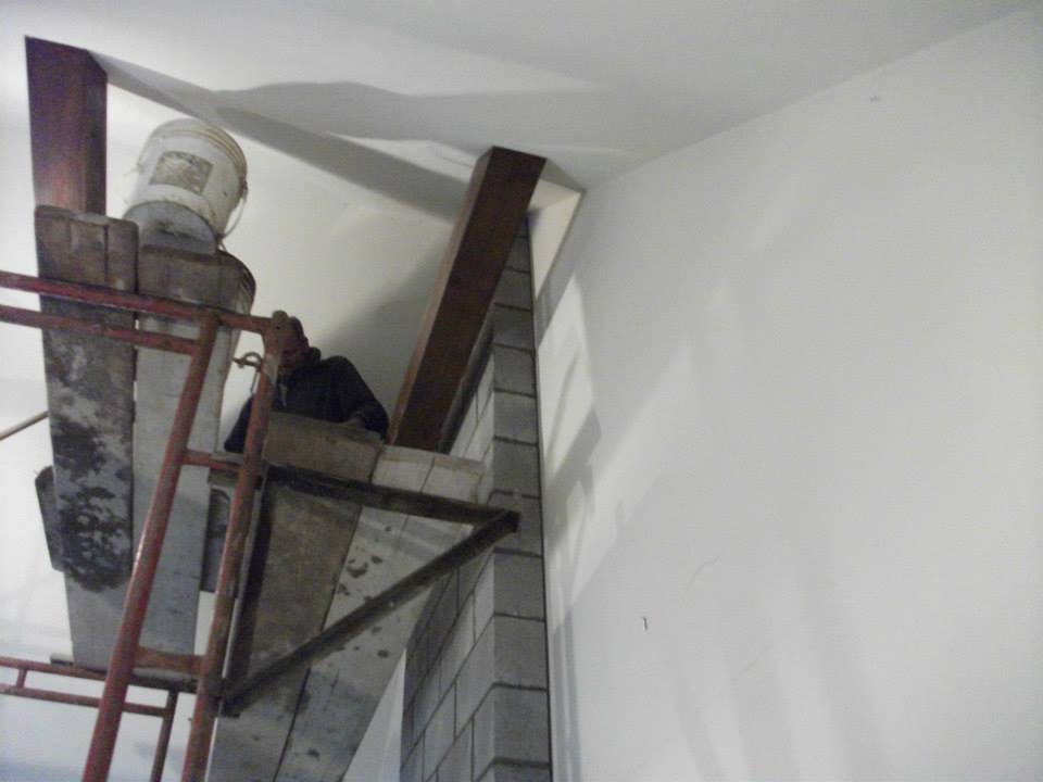 Worker Using Scaffolding for Fireplace Construction — North Royalton, OH — Advanced Masonry & Chimney Service