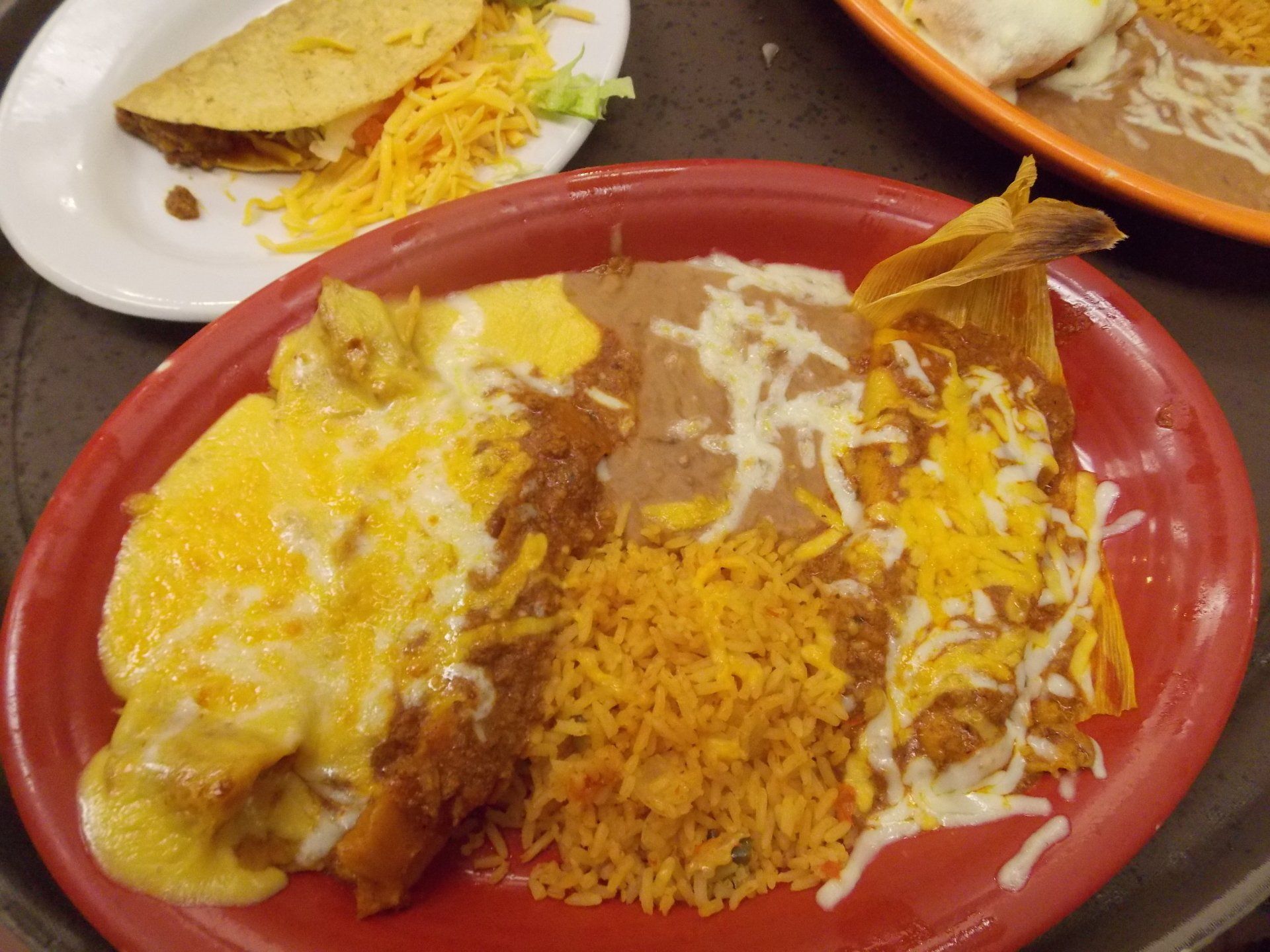 A close up of a plate of mexican food on a tray