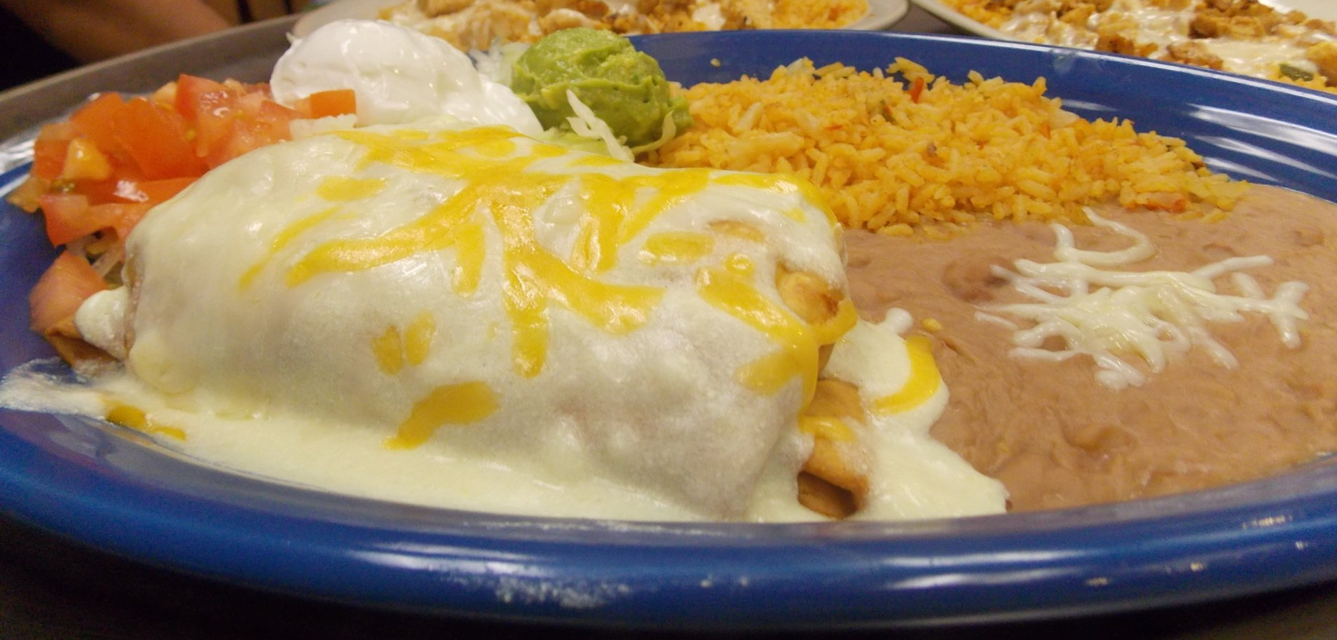 A close up of a plate of mexican food on a table.