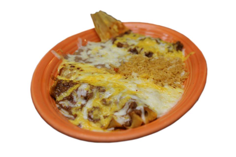 A close up of a plate of food on a white background