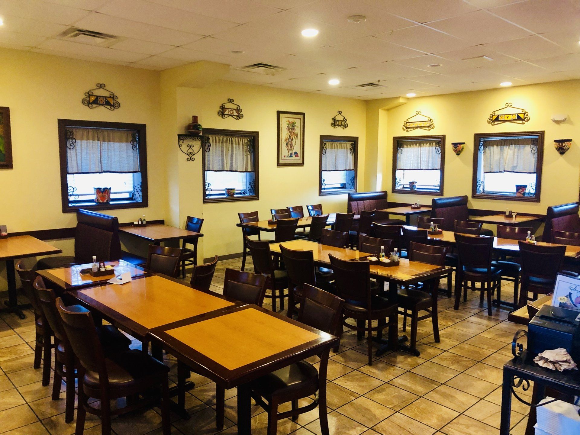 A large dining room with tables and chairs in it