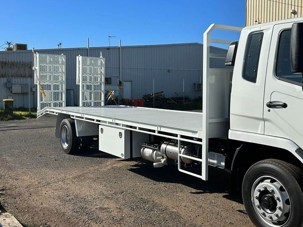 Truck Tray of A Flatbed Truck Is Parked in A Parking Lot — EJF Welding in Dubbo, NSW