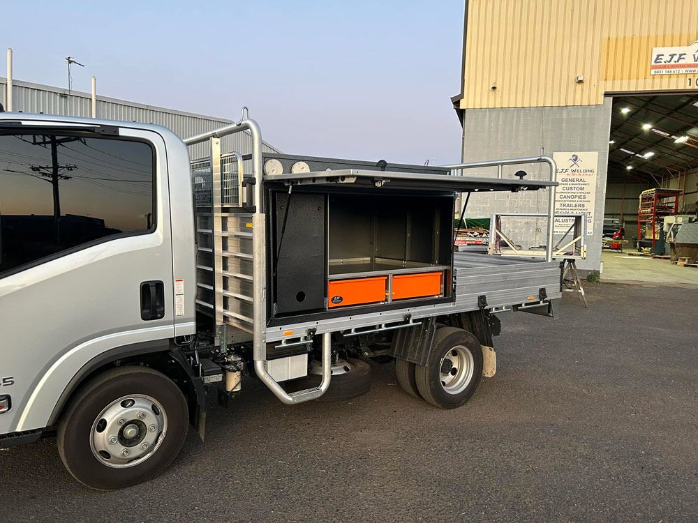 A Truck Is Parked in A Parking Lot in Front of A Building — EJF Welding in Dubbo, NSW