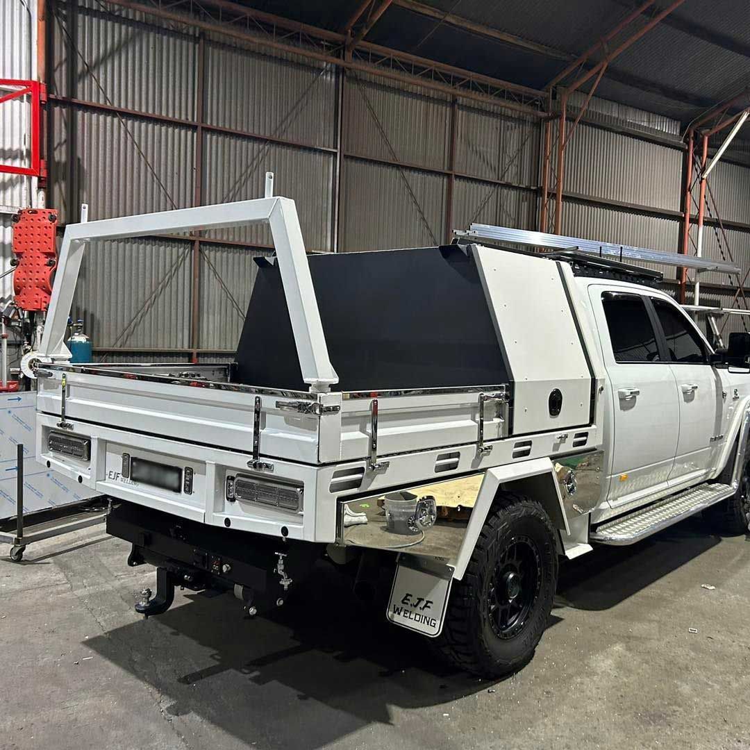 White Truck With UTE Tray On The Back Is Parked In A Garage — EJF Built in Dubbo, NSW