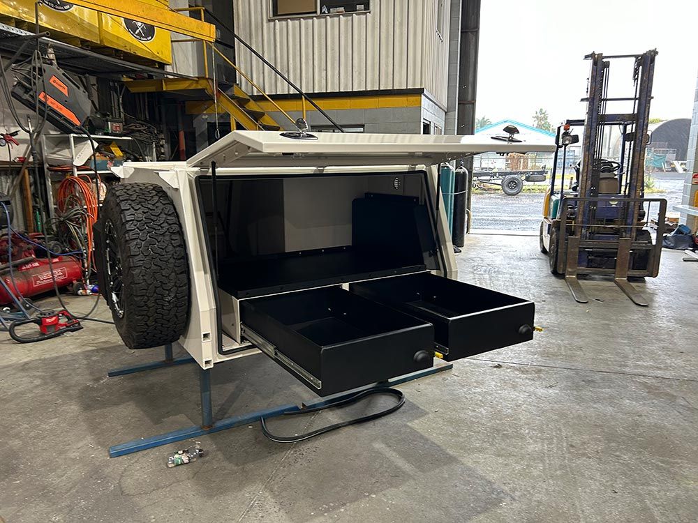 A Canopy With Drawers Underneath It Is Sitting In A Garage — EJF Built in Dubbo, NSW