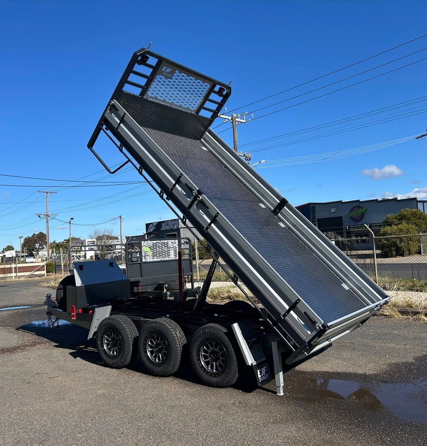 Gray Dump Trailer Raised, Parked Outdoors on a Sunny Day — EJF Built in Dubbo, NSW