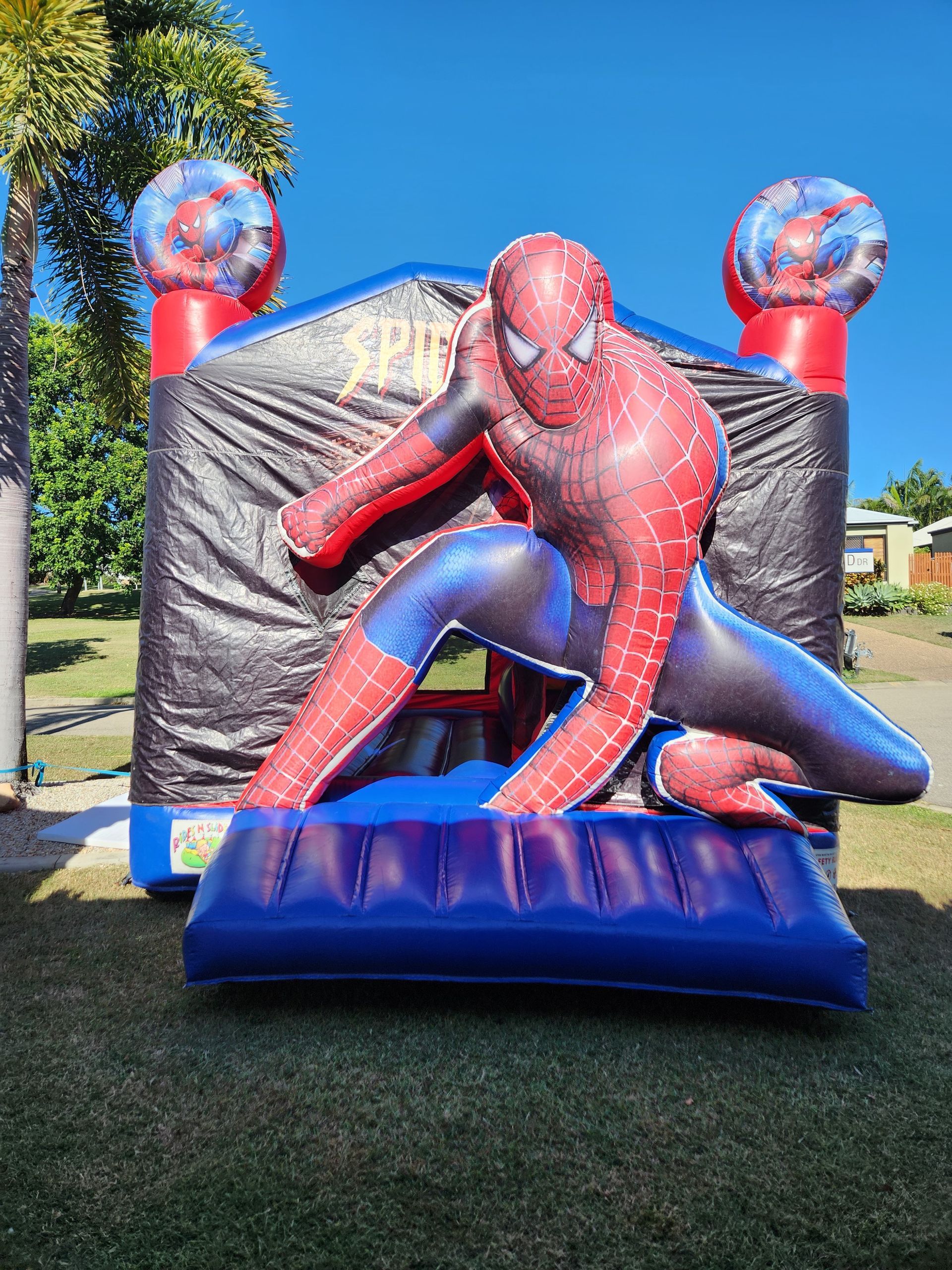 A Young Boy Is Riding A Mechanical Bull In A Park — Rides N Slides In Townsville, QLD
