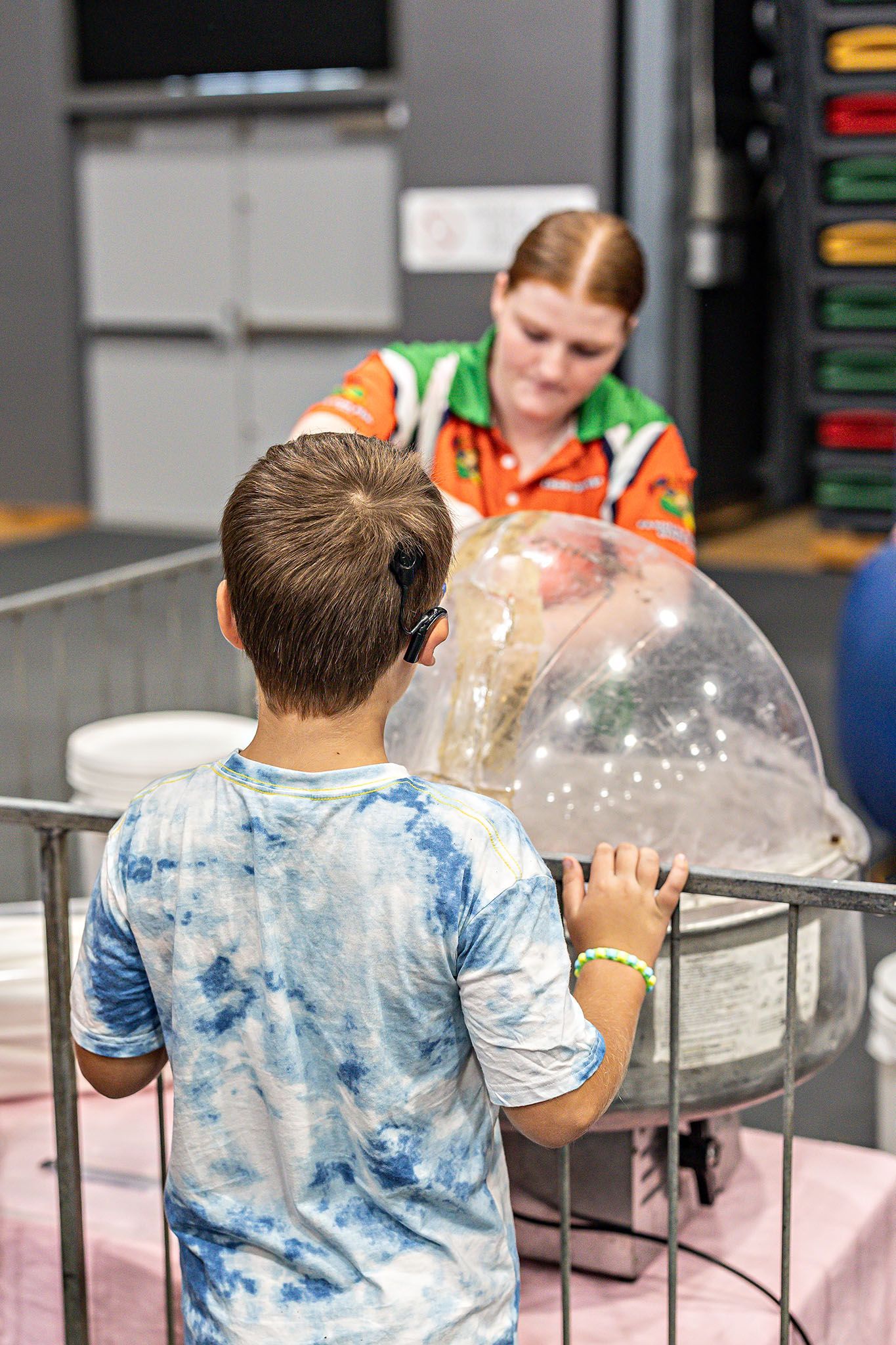 A child standing waiting for candy floss — Rides N Slides In Townsville, QLD