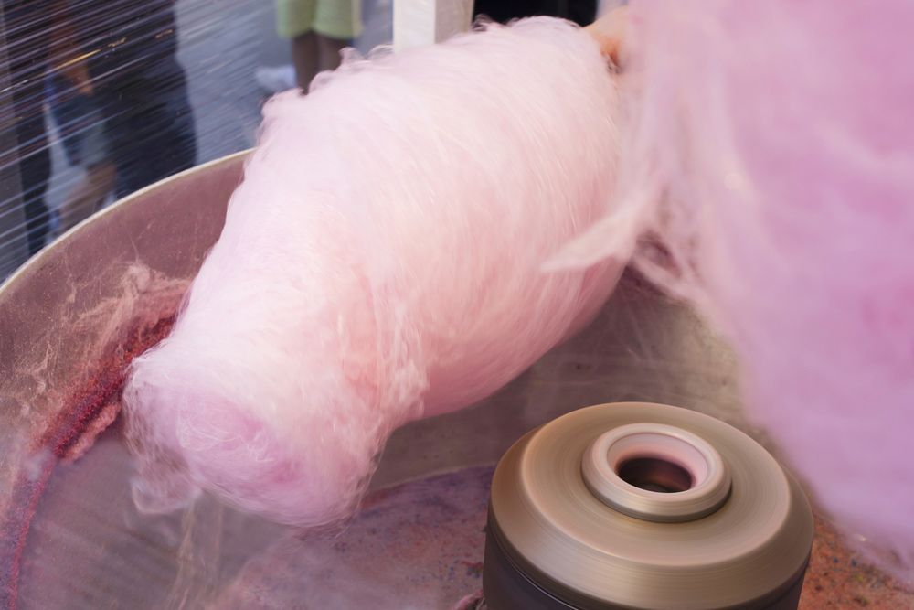 Pink Cotton Candy Is Being Made In A Machine — Rides N Slides In Townsville, QLD