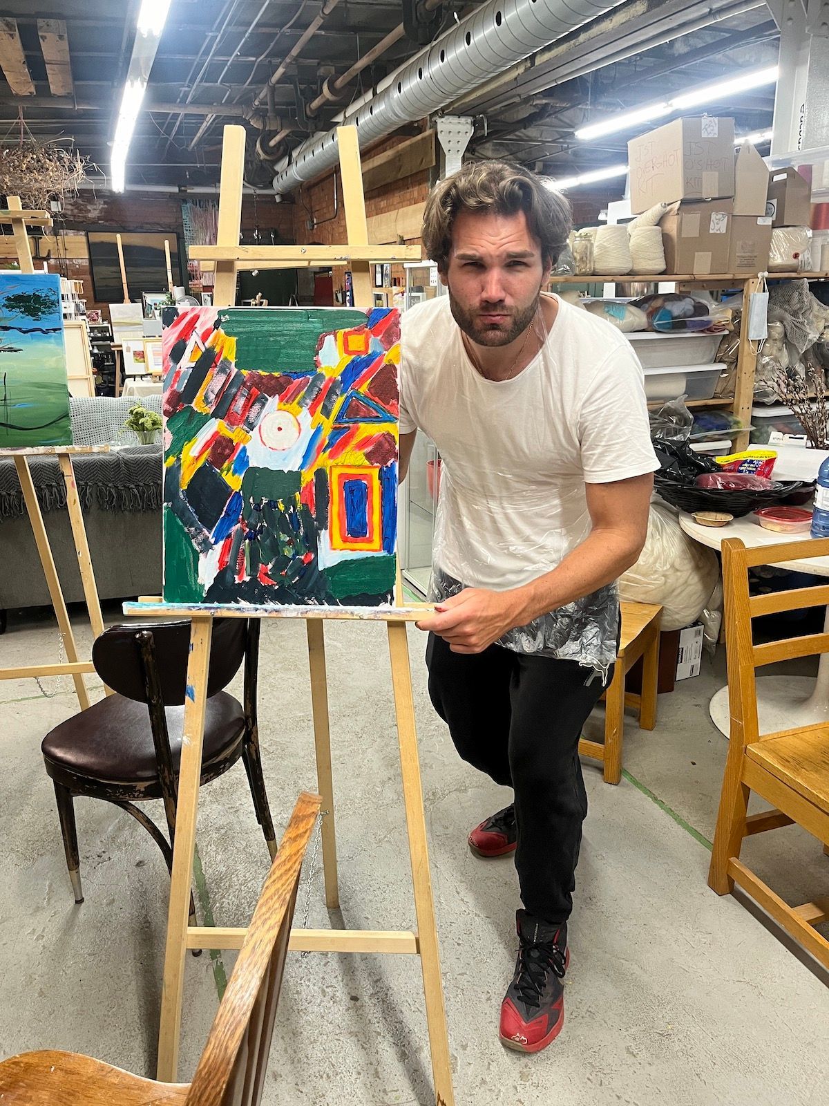 Student presentation of final abstract painting in studio k2 class