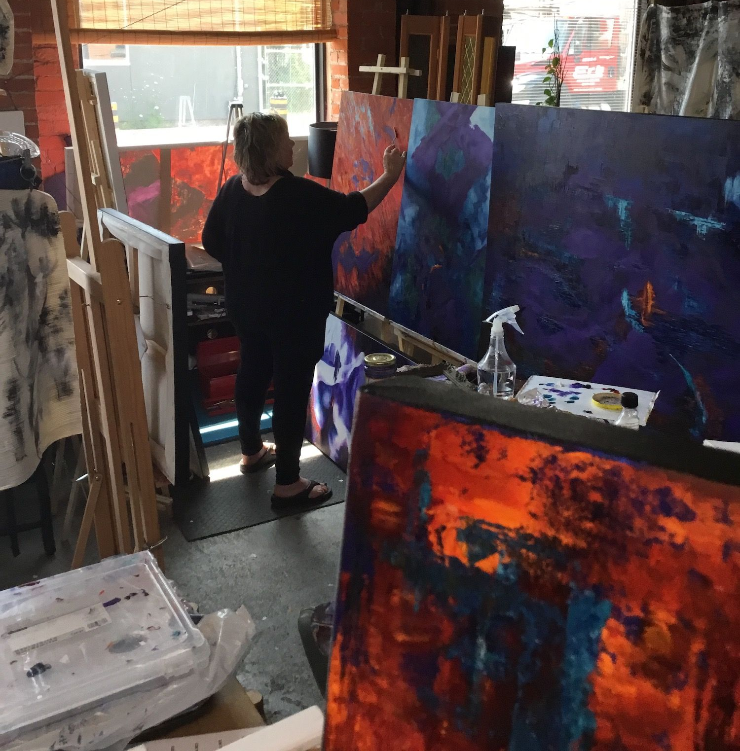 Karen Klucowicz painting a series in studio