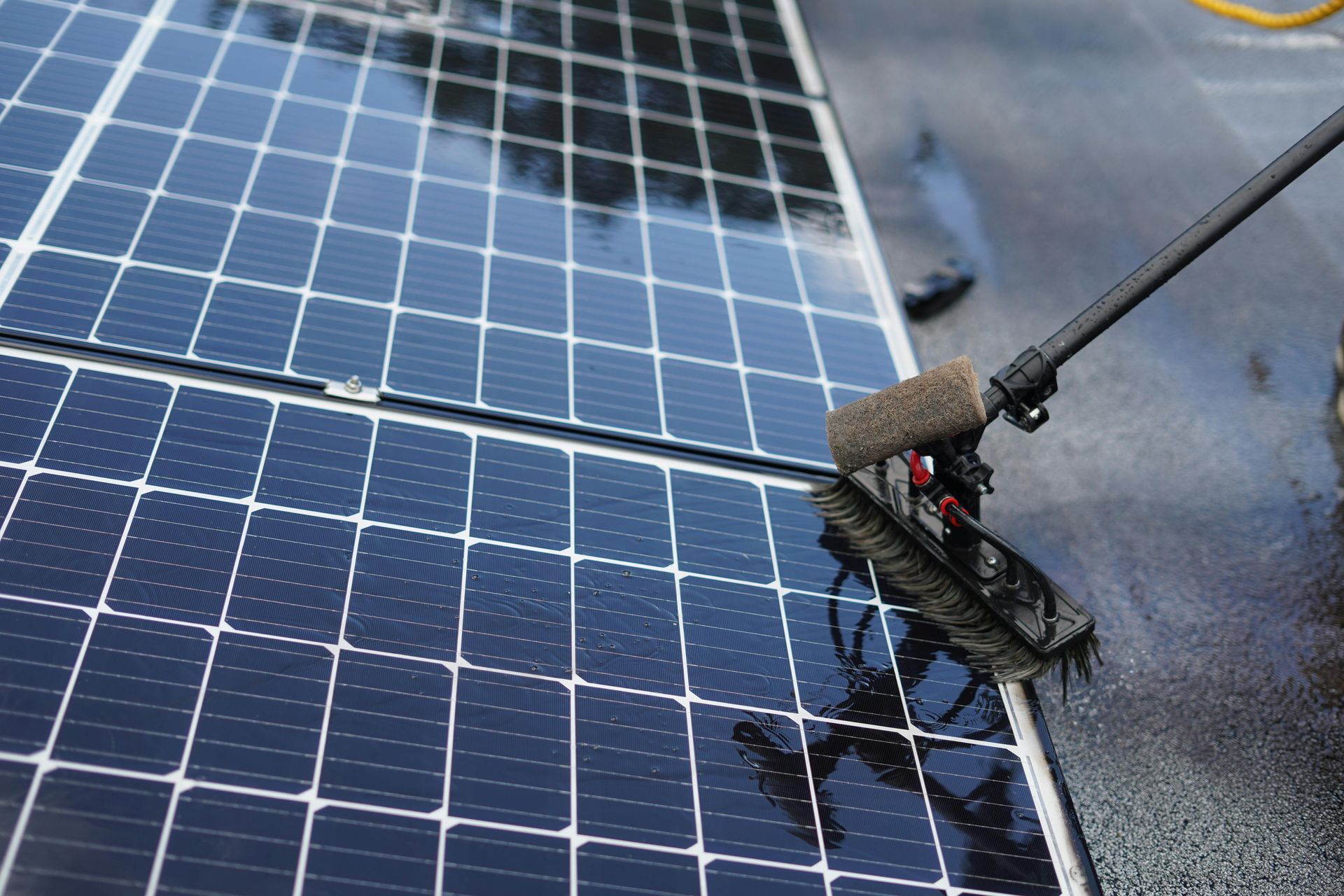 A row of solar panels on the roof of a house