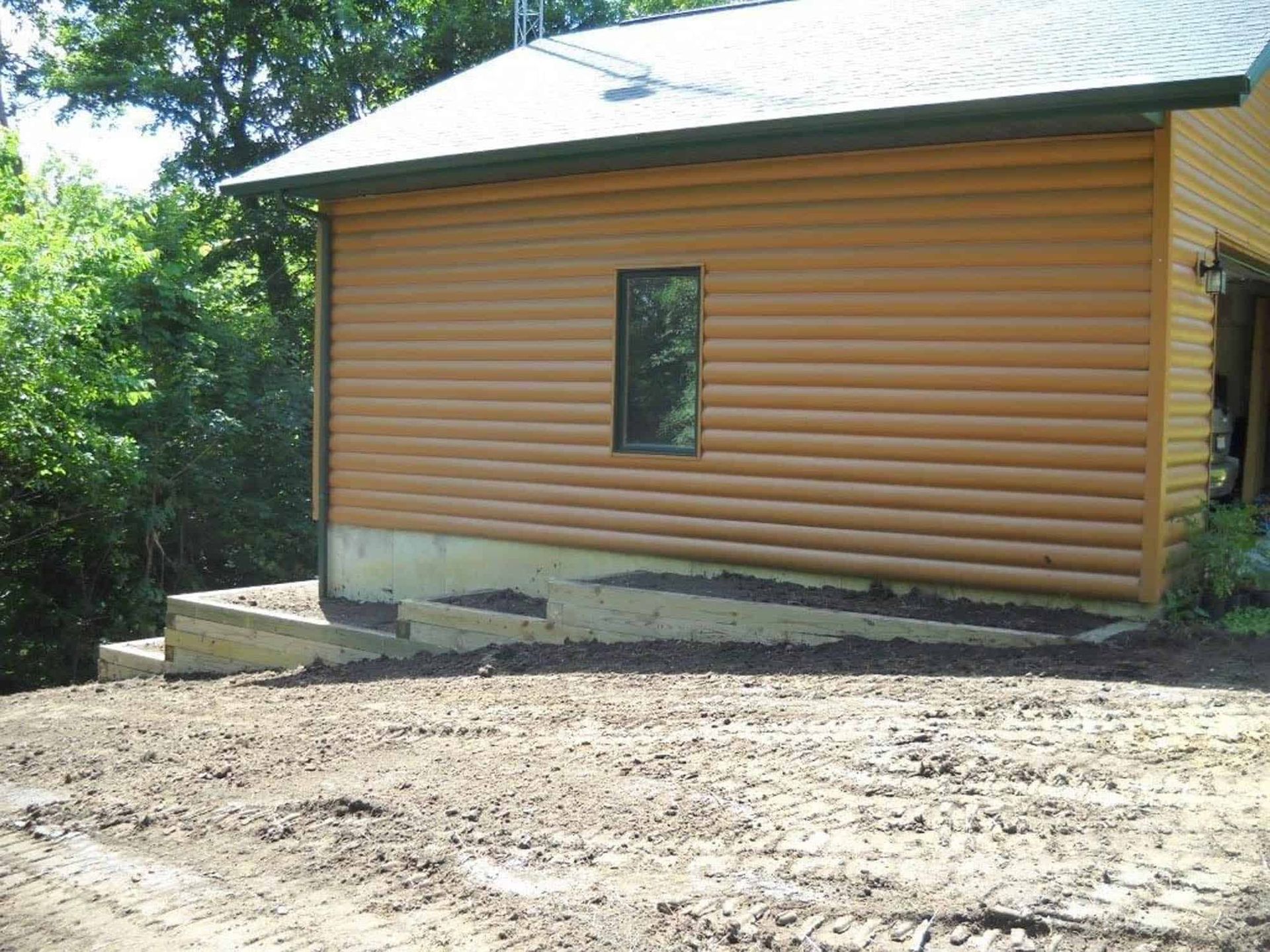 A log cabin with a window on the side of it