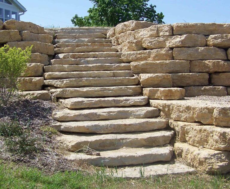 A set of stone stairs leading up to a house