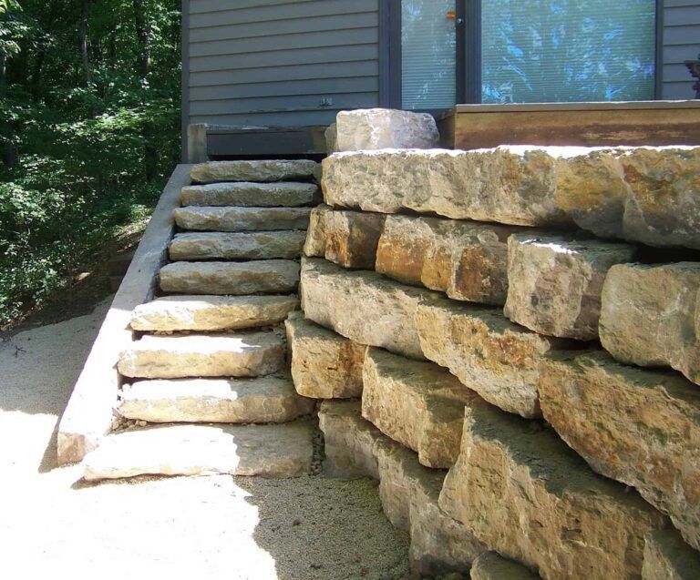 A set of stone stairs leading up to a house