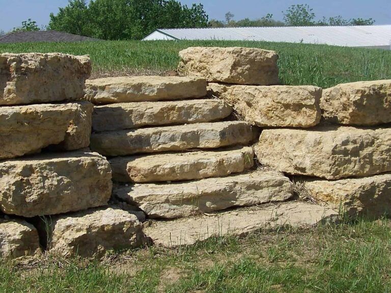 A pile of rocks stacked on top of each other in a field