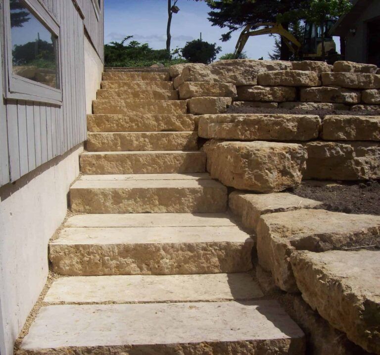 A set of stone stairs leading up to a house