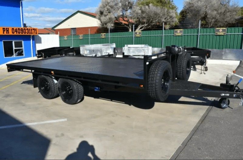 A Flatbed Trailer is Parked in a Parking Lot — Voyager Trailers in Nightcliff, NT